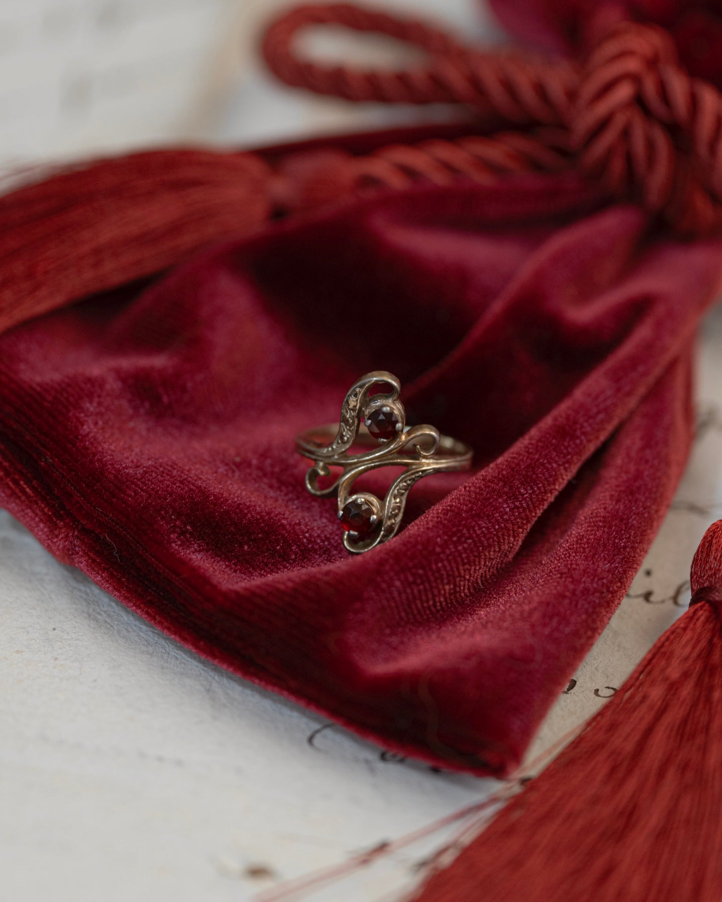 Garnet and Gold Plated Ring with Romantic Curves